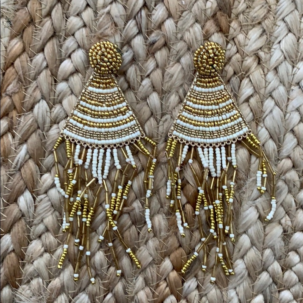 Long gold statement earrings